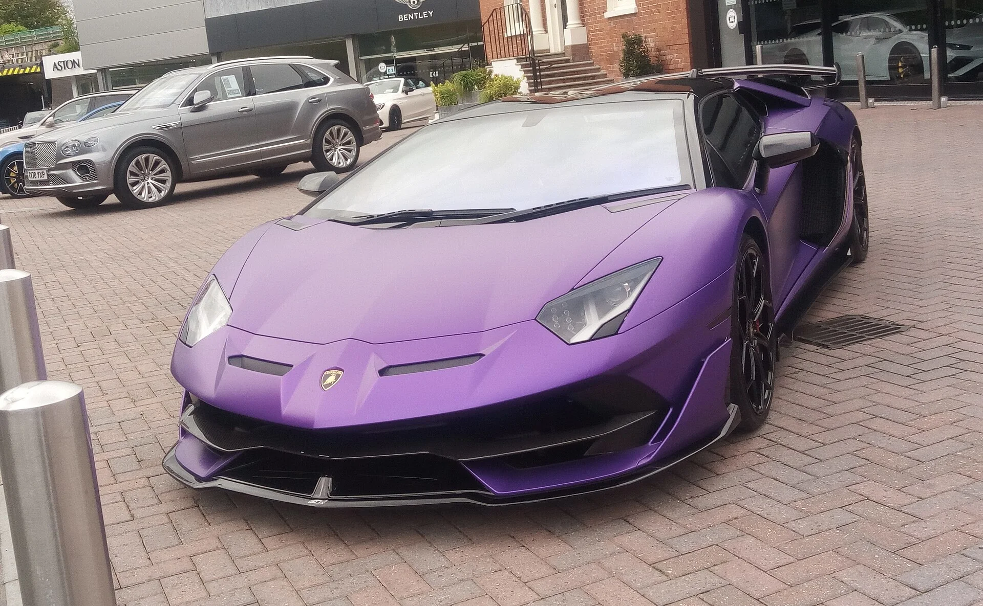 Purple Lamborghini Aventador SVJ in a low front three-quarter view