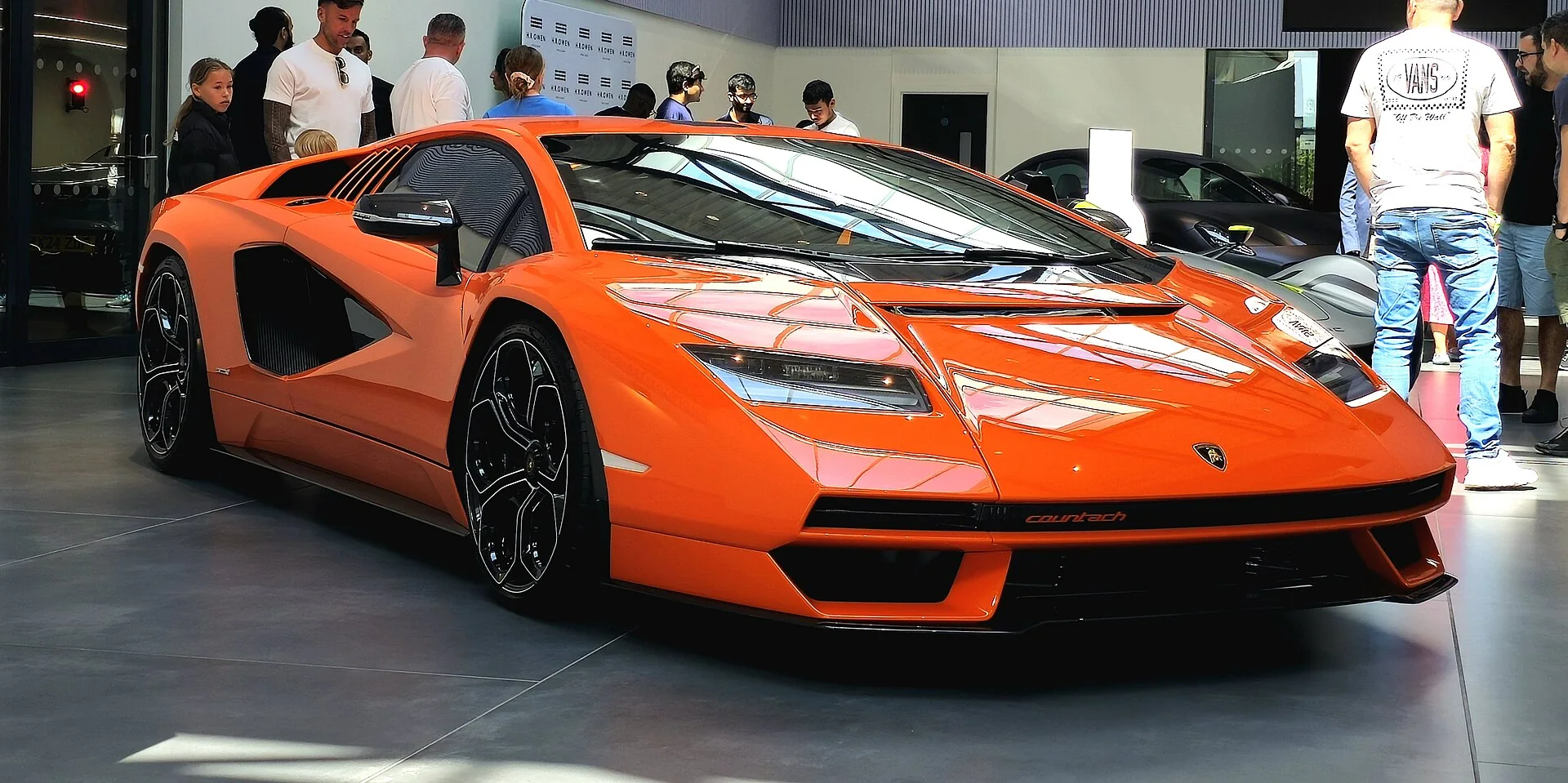 Orange Lamborghini Countach LPI 800-4 in a front three-quarter exhibition view