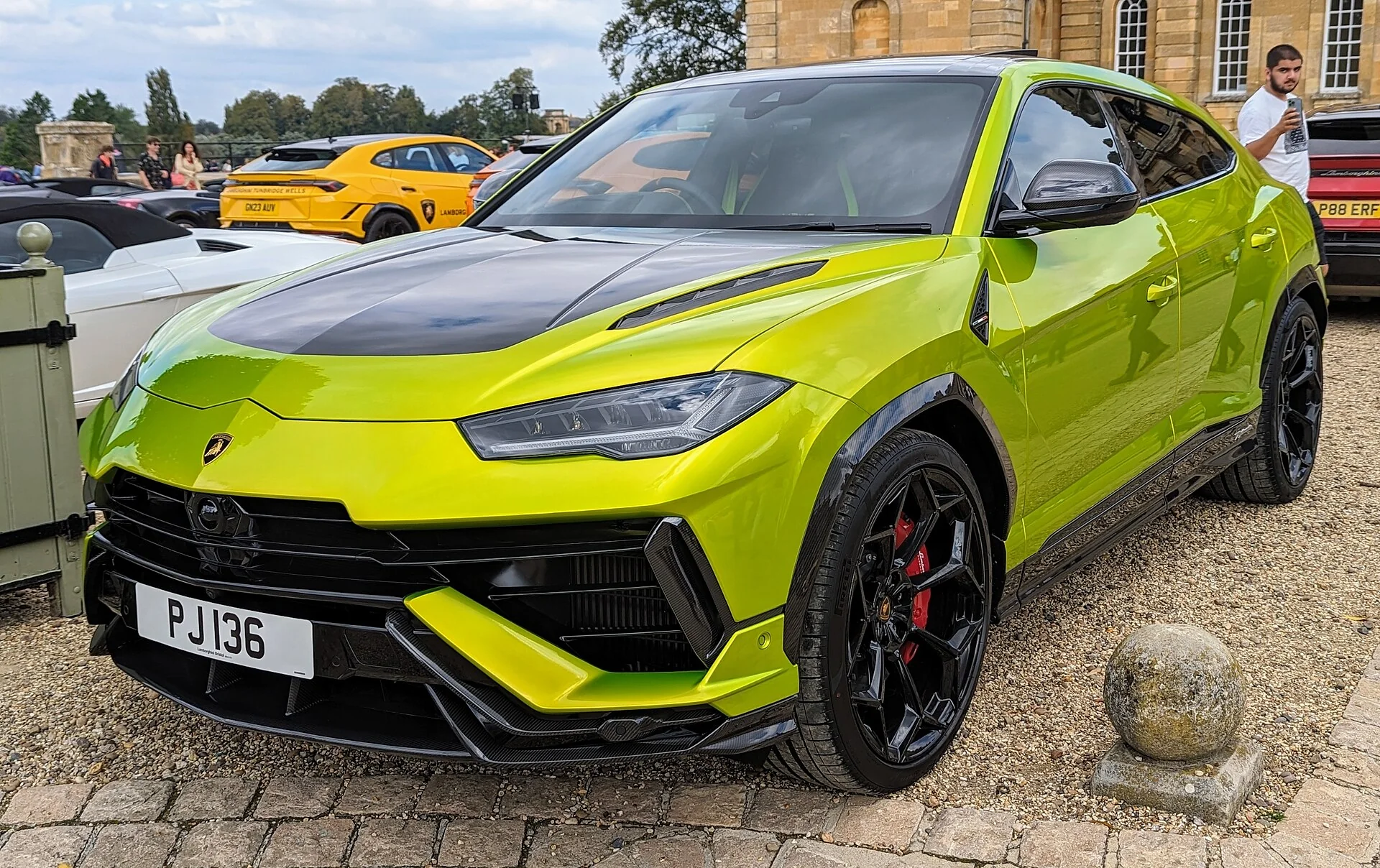 Green Lamborghini Urus Performante in a front three-quarter view outdoors